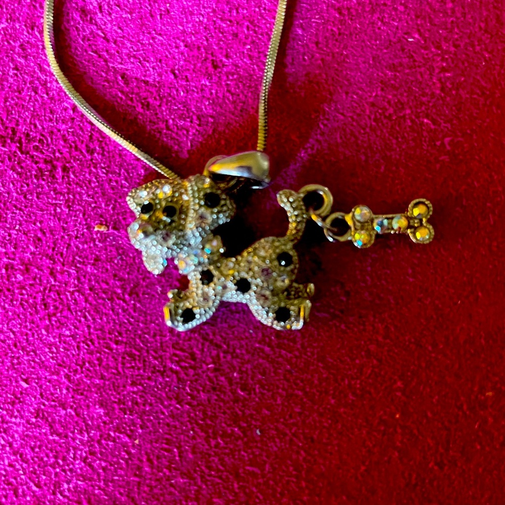Dog with bone sparking pendant on chain